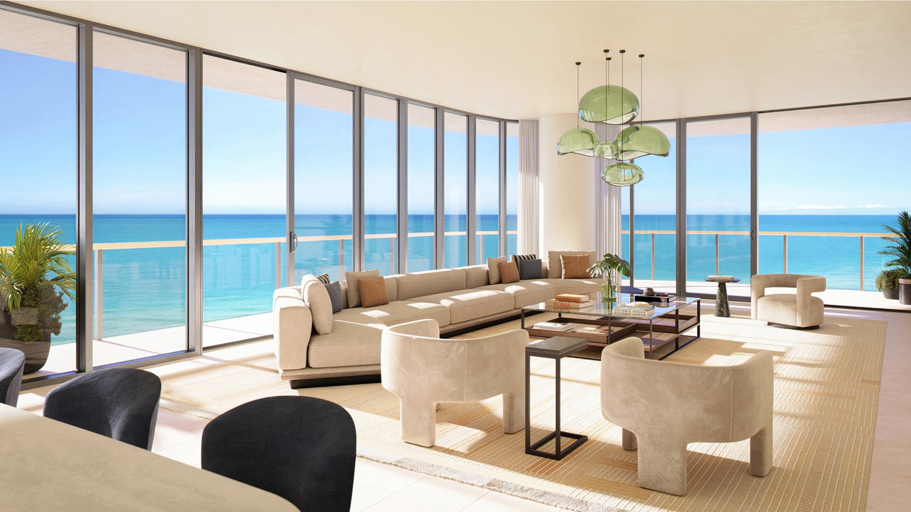 Luxury oceanfront condo living room with floor-to-ceiling ocean views